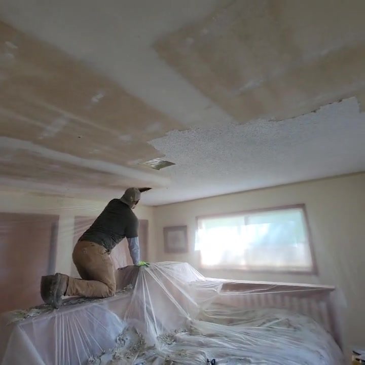 Interior work video with protected surfaces and a worker visible.